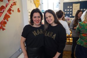 Emma France and Giovanna Fletcher posing with the MAMA tee and jumper