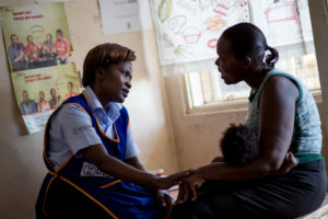 Mentor Mother speaking with a client in Uganda